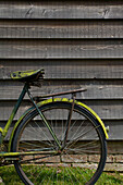 Vintage bicycle and woodclad exterior of rural of Kent home England UK