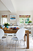 Wooden kitchen table with white chairs in Bishops Sutton kitchen Alresford Hampshire England UK
