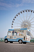 Ice cream van with Brighton wheel on seafront Brighton and Hove Sussex England UK