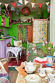 Pink tulips and cupcakes with teapot and cups in Brighton Sussex England UK