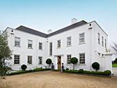 Whitewashed facade with gravel driveway Faversham home Kent England UK
