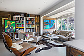 Living room with bookcase and modern art in Rye East Sussex UK