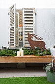 Reindeer ornament and shutters in London home UK