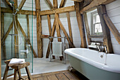 Freestanding bath and walk in shower on 'dust floor' of Grade ll listed windmill conversion Kent UK