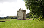 Stone castle exterior with lawn Scotland UK
