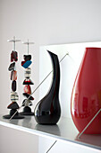 Vases and polished stone on shelf of contemporary London home, England, UK