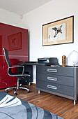 Home office desk and chair with red storage unit in Newmarket home Suffolk UK