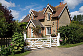 Brick and stone gated exterior of Kent country house UK