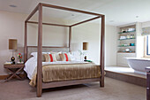 Four poster bed with bath en suite in Cotswolds home UK
