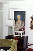 OIl painting, casket and lamp on Oriental lacquered cabinet in Sussex farmhouse, UK