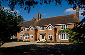 Brick exterior with gravel driveway Surry home UK