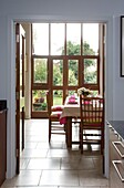 View through double doors to dining room of Sussex home
