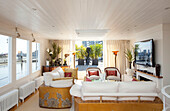 Living room with open doors on London houseboat