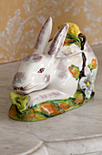 China rabbit ornament on marble shelf in Sussex farmhouse, England, UK