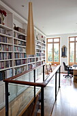 Bookcase storage in home office of contemporary London townhouse, England, UK