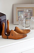 Vintage shoe stretchers with glass bottles in London townhouse, England, UK