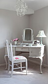 Dressing table with upholstered chair in bedroom of Maidstone farmhouse, Kent, England, UK