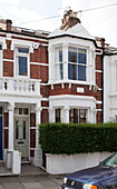 Brick exterior with white paintwork of London townhouse, England, UK