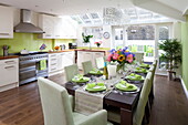 Open plan kitchen and dining room in contemporary London townhouse, England, UK