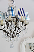 Assorted lampshades on chandelier in Dulwich home London England UK