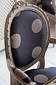 Upholstered antique chair in London home, England, UK