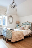 Upholstered antique bed in Kent home, England, UK