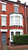 Brick exterior of three storey London townhouse England UK