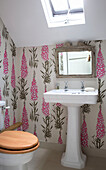 Pink foxglove wallpaper in attic bathroom of Herefordshire home, England, UK
