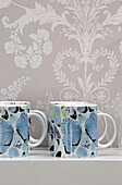 Butterfly prints on kitchen shelf in contemporary London townhouse, England, UK