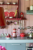 Kitchenware on worktop and shelves in Brittany cottage, France