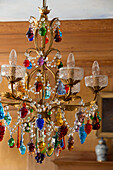 Multicoloured glass chandelier in London home, UK