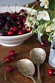 Bowl of cherries and silver spoons in Presteigne cottage Wales UK