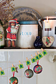 Christmas decorations with flour tin in kitchen of Berkshire home,  England,  UK