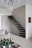 Open tread staircase with glass banister in contemporary London home   UK