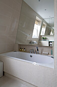 Recessed mosaic tiled bathroom with mirror in contemporary London home   UK