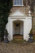Whitewashed porch entrance to King's Lynn Georgian farmhouse  Norfolk  England  UK