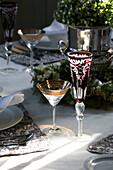 Vintage glassware with ice bucket centrepiece on dining table in Berkshire home,  England,  UK