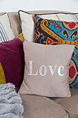 Single word 'Love' on cushion in Surrey home   England   UK