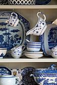 Blue and white chinaware on kitchen dresser in Surrey home,  England,  UK