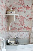 Toile de Jouy wallpaper with corner shelf and sink in Georgian home Berkshire England UK
