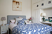 Blue and white paisley duvet in London townhouse bedroom with built-in storage
