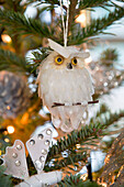 White owl decoration in Christmas tree Sussex England UK