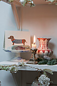 Greetings card and lit candle in London home England UK
