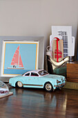 Toy car and artwork with souvenirs in London townhouse apartment UK
