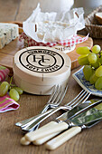 Cheese and grapes with cutlery in Grade II listed cottage in Hampshire England UK