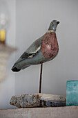 Wooden bird statue in Sussex beach house England UK