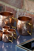 Hammered copper cup set in Sussex home England UK