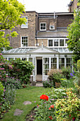 Conservatory extension in back garden of London townhouse UK