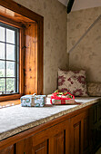 Gift wrapped presents on window seat in Berkshire home UK