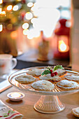 Mince pies on glass cake stand in Georgian cottage kitchen Liverpool UK